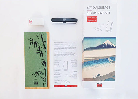 KOTAI's sharpening ceramic whetstone or water stone grit 180/800 on a black background.