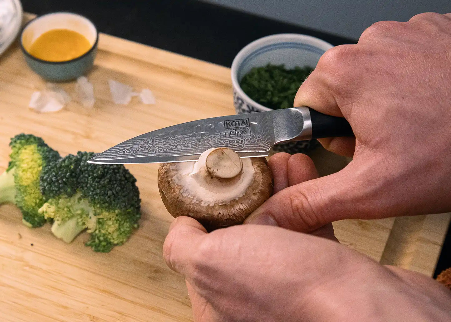 6-Piece Essential Pakka Damascus knife set with patterned AUS-10 blades and pakkawood handles.