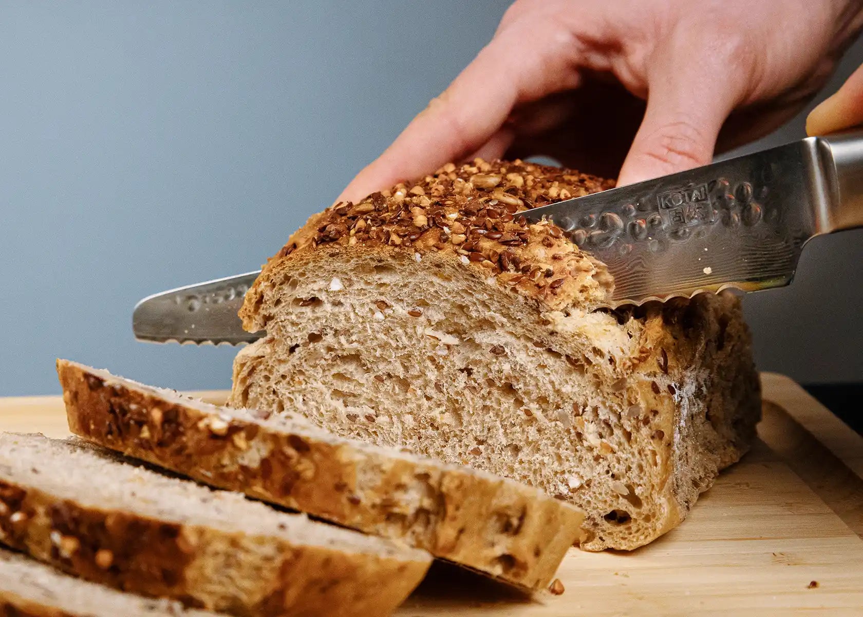 3-Piece Essential Pakka Damascus knife set with patterned AUS-10 blades and pakkawood handles.