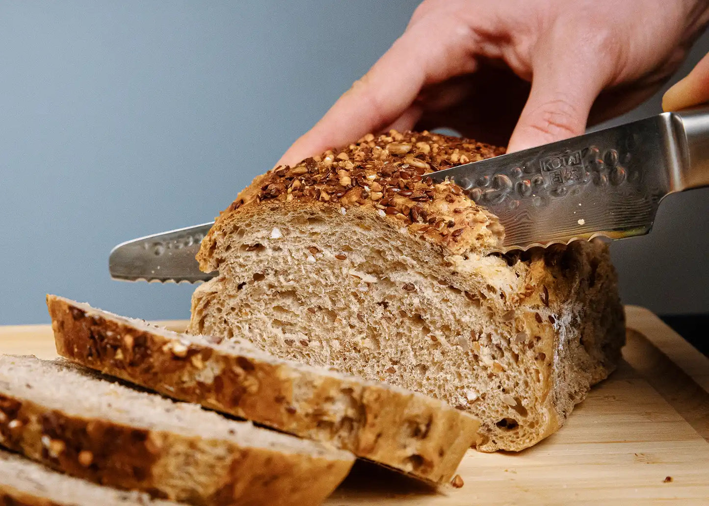 6-Piece Essential Pakka Damascus knife set with patterned AUS-10 blades and pakkawood handles.