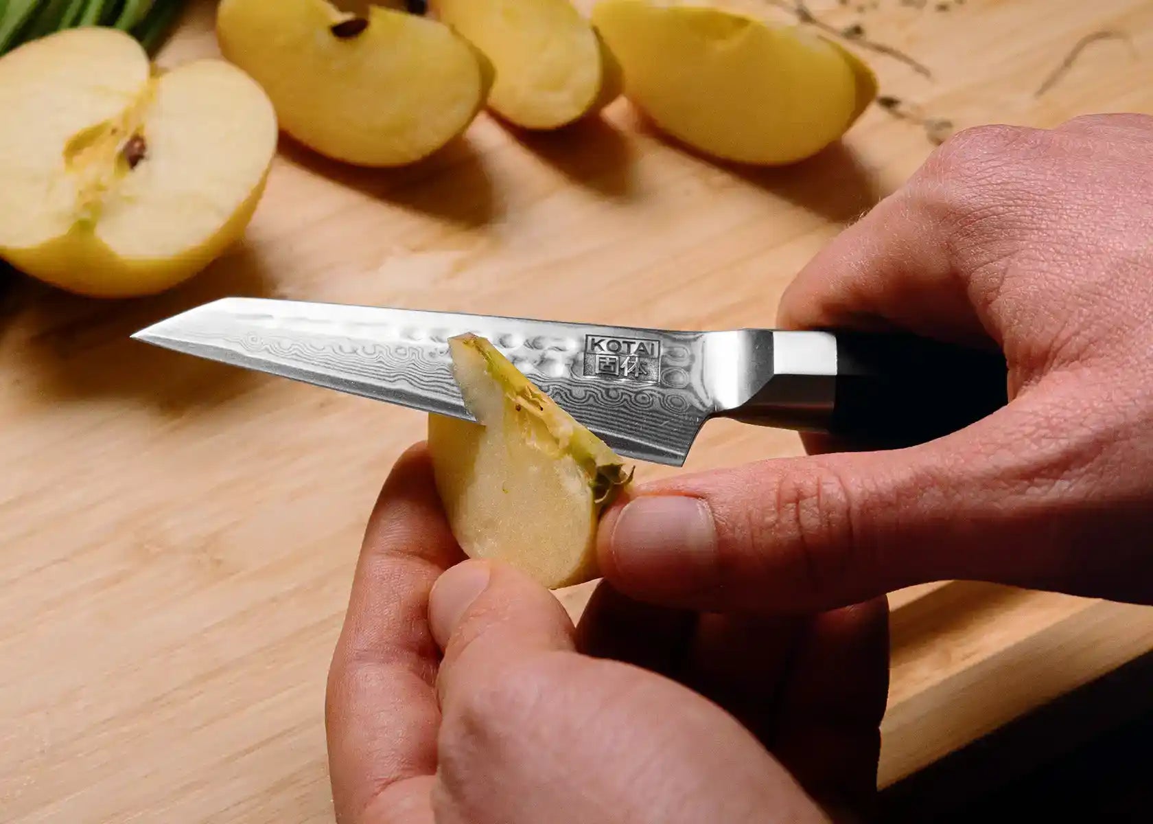 9 cm Paring knife with AUS-10 Damascus blade and ebony handle.
