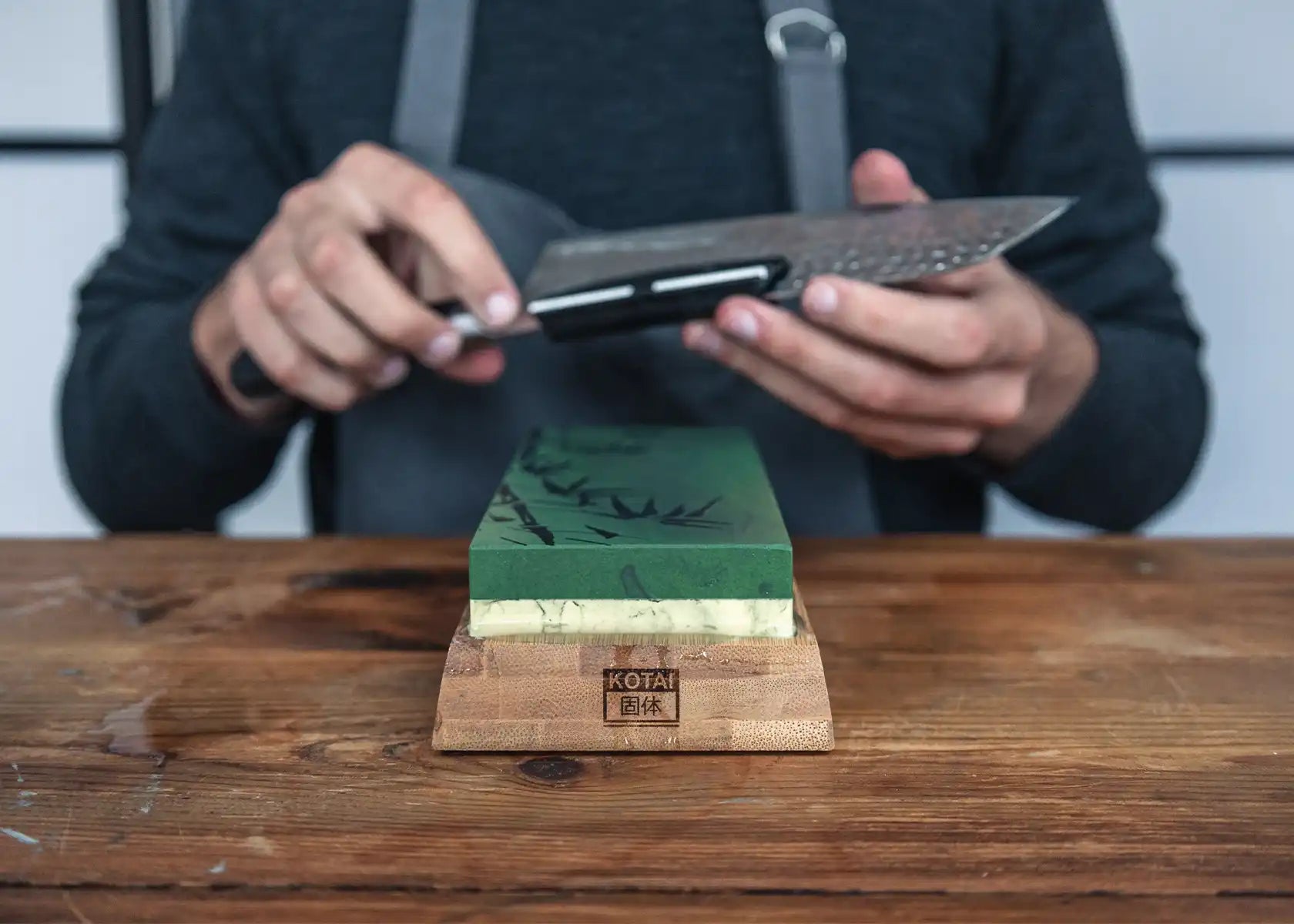Dual-grit water stone sharpener (180/800) with bamboo base and guide.