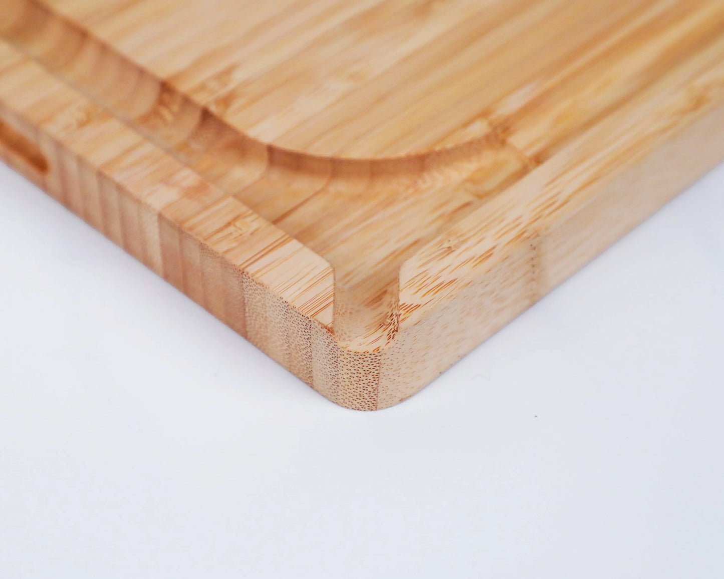 Rectangular bamboo cutting board with smooth double-sided surface.