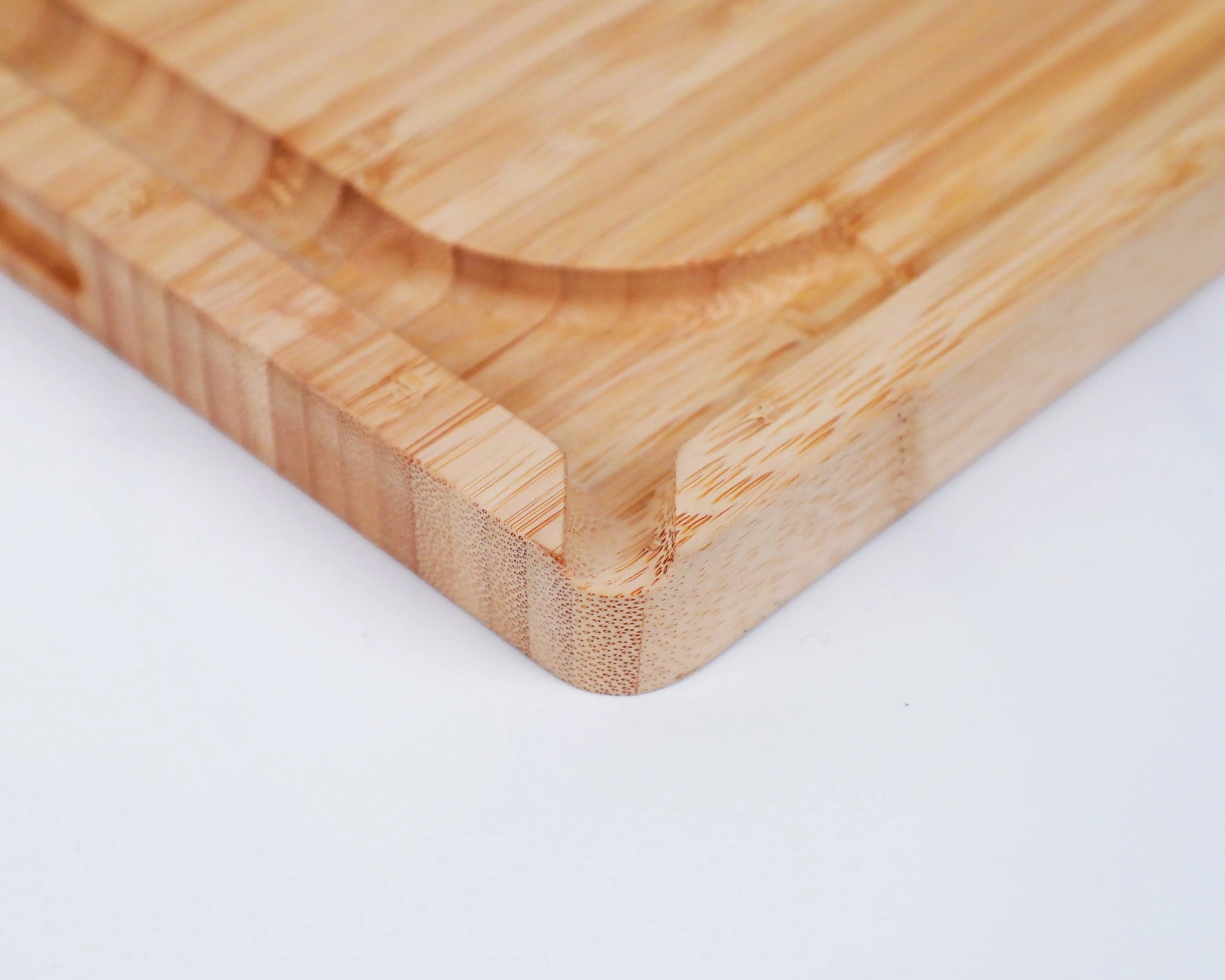 Rectangular bamboo cutting board with smooth double-sided surface.