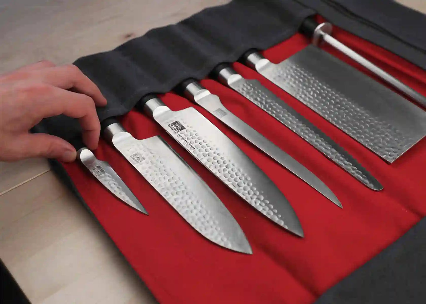 Canvas and leather roll-up knife bag for up to seven knives and steel.