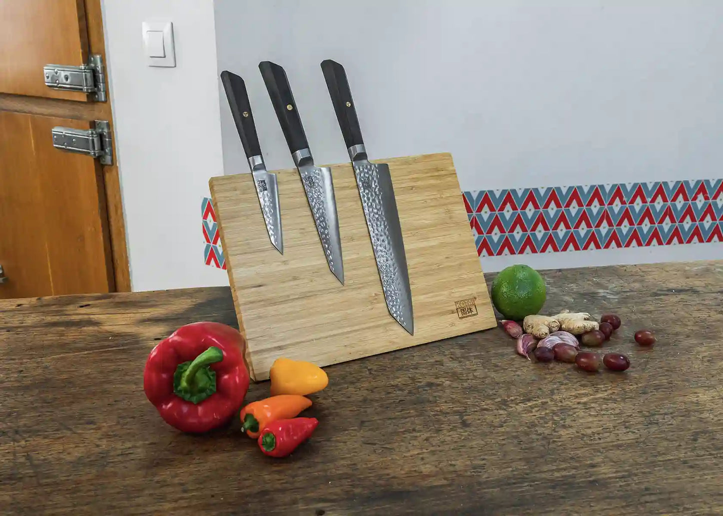 6-Piece Essential Bunka Damascus knife set with patterned AUS-10 steel blades and ebony handles.