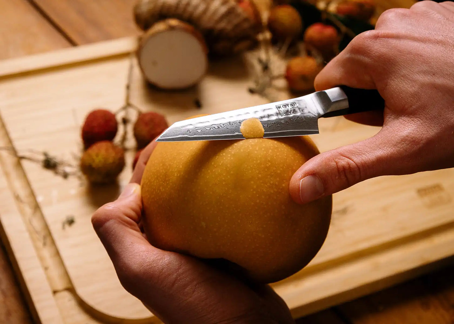 9 cm Paring knife with AUS-10 Damascus blade and ebony handle.
