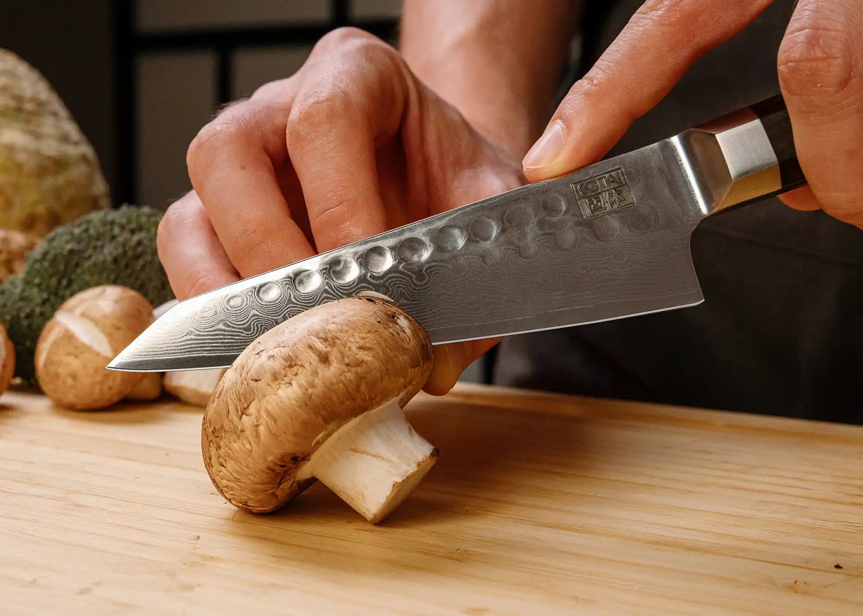 13.5 cm Petty knife with AUS-10 Damascus blade and ebony handle.