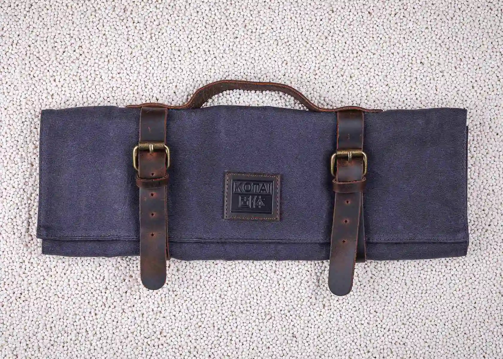 Canvas and leather roll-up knife bag for up to seven knives and steel.
