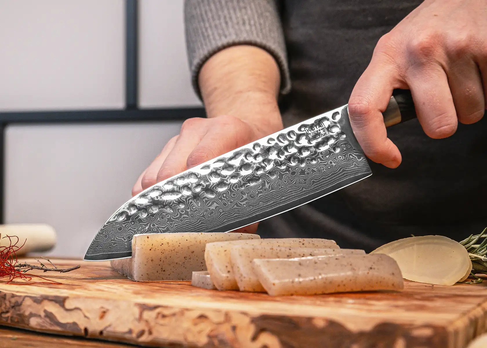 18 cm Santoku knife with 440C blade and black pakkawood handle.