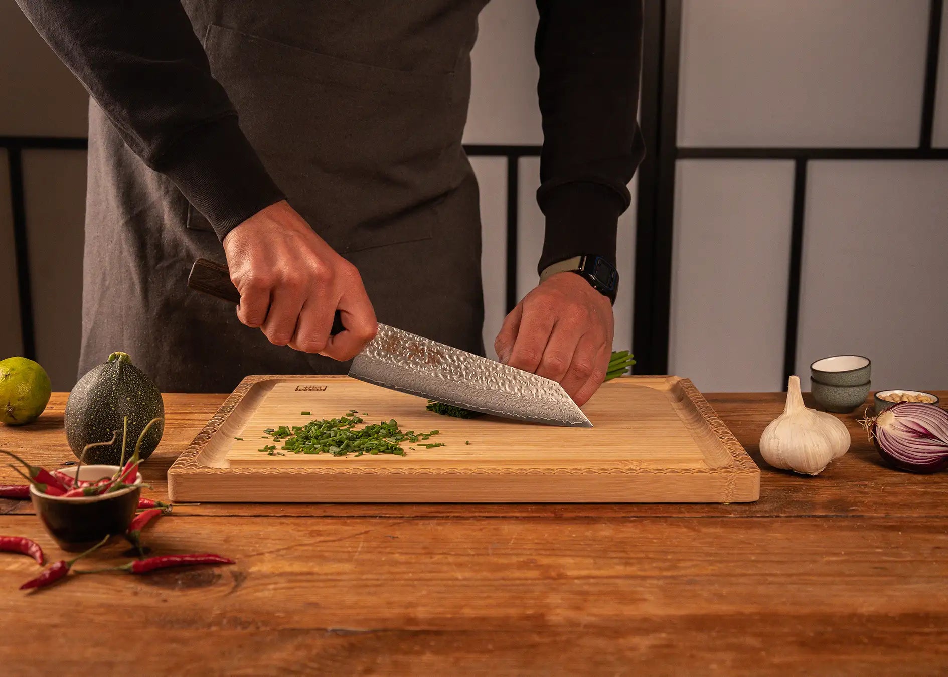 190 mm Kiritsuke knife with VG-10 Damascus blade and octagonal pakkawood handle.