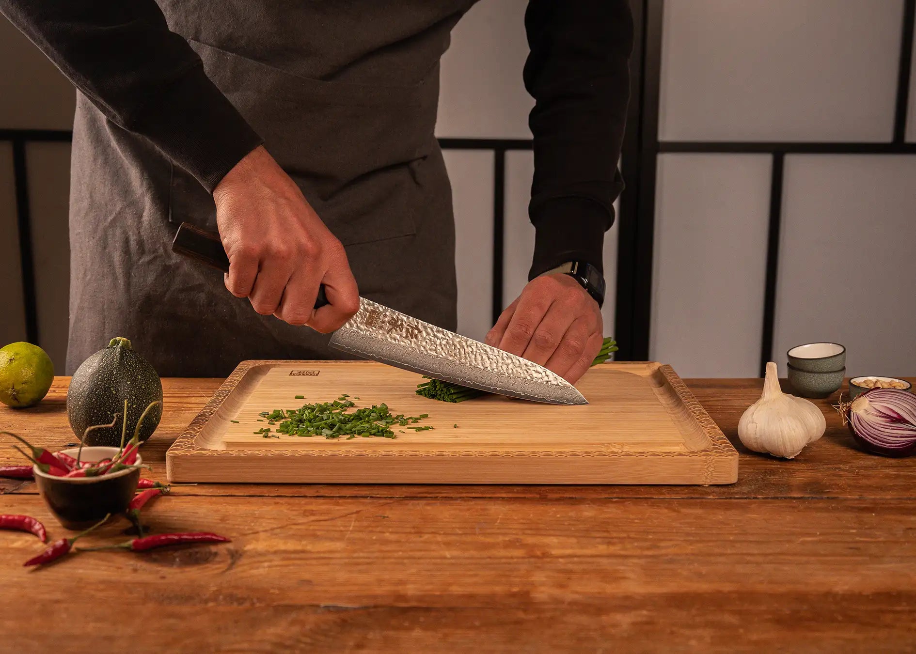 210 mm chef Gyuto knife with VG-10 Damascus blade and pakkawood handle.