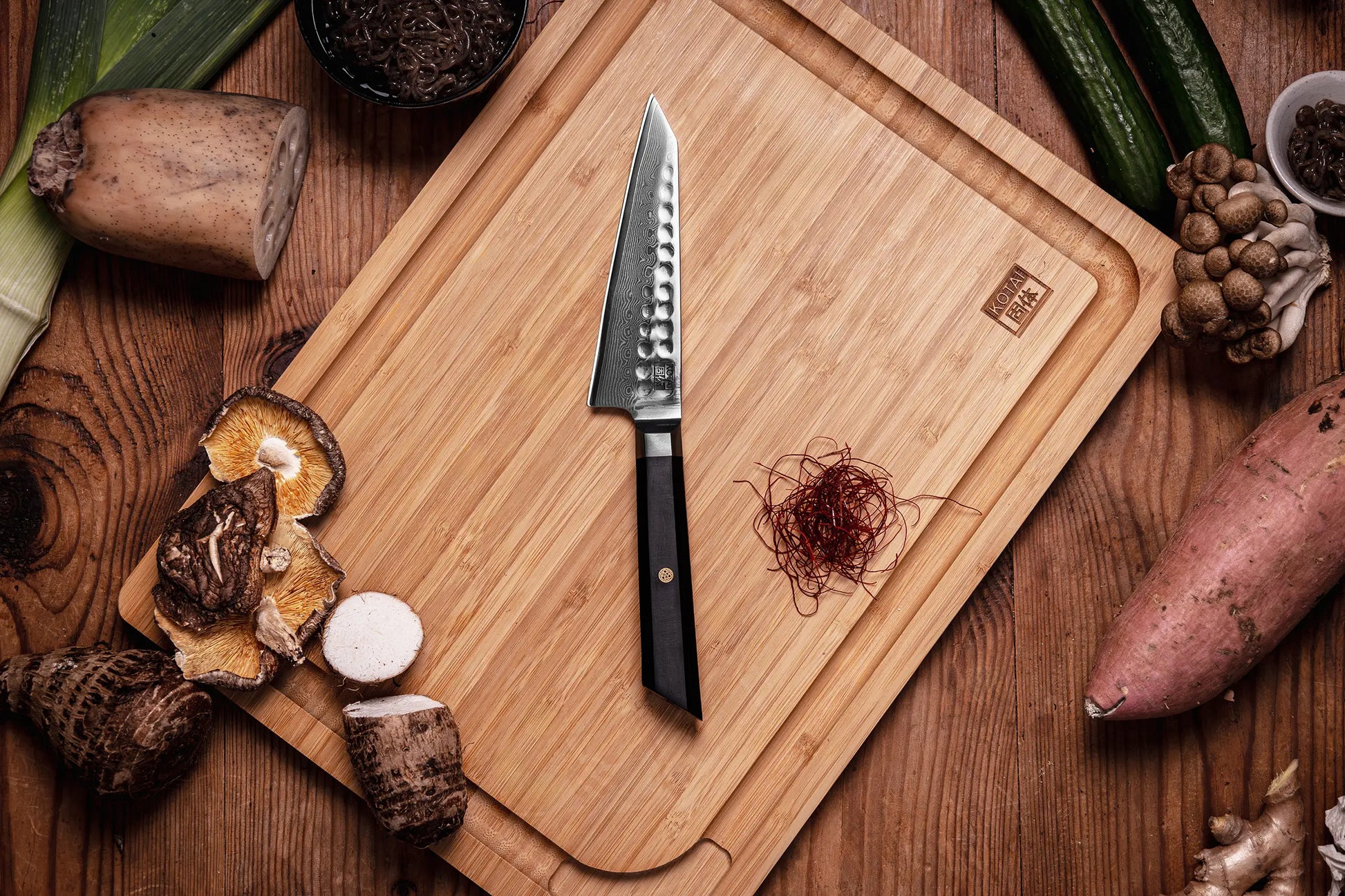 13.5 cm Petty knife with AUS-10 Damascus blade and ebony handle.