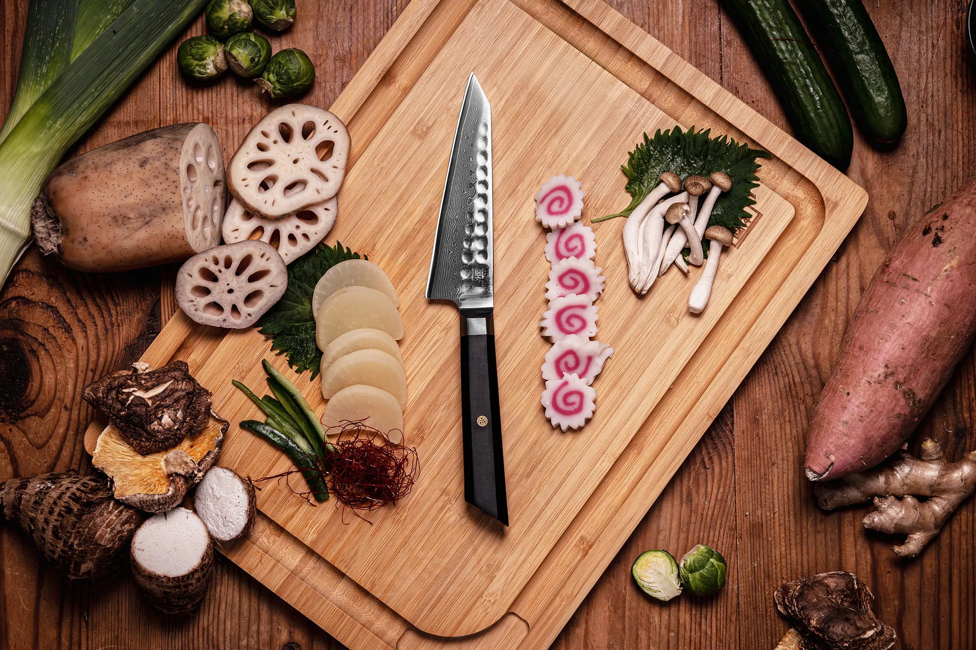 13.5 cm Petty knife with AUS-10 Damascus blade and ebony handle.