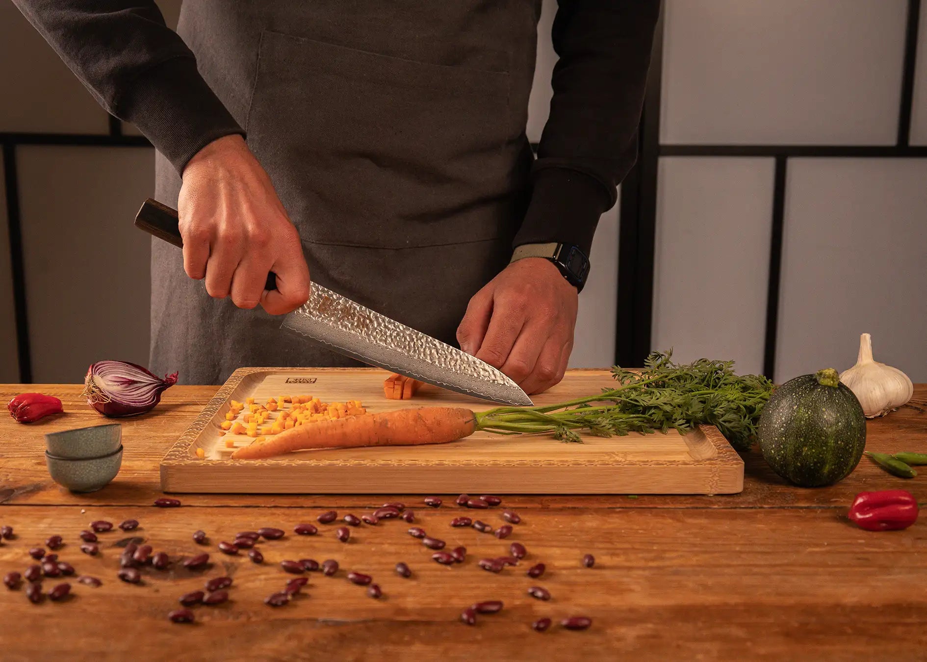 210 mm chef Gyuto knife with VG-10 Damascus blade and pakkawood handle.