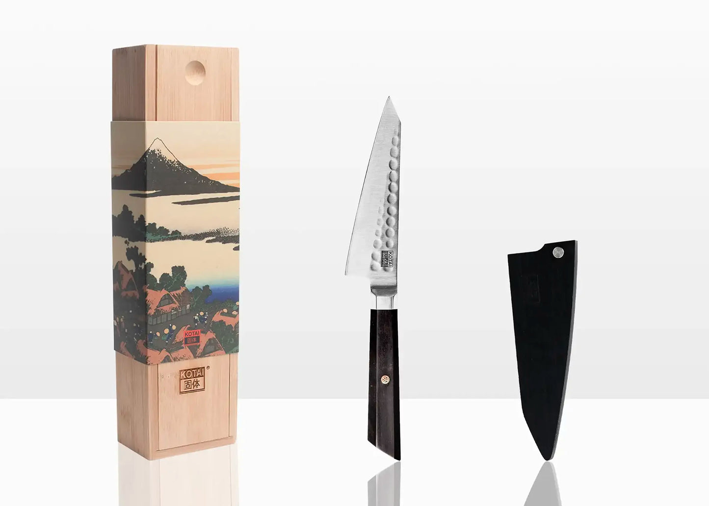 13.5 cm petty knife crafted from 440C steel with ebony handle.