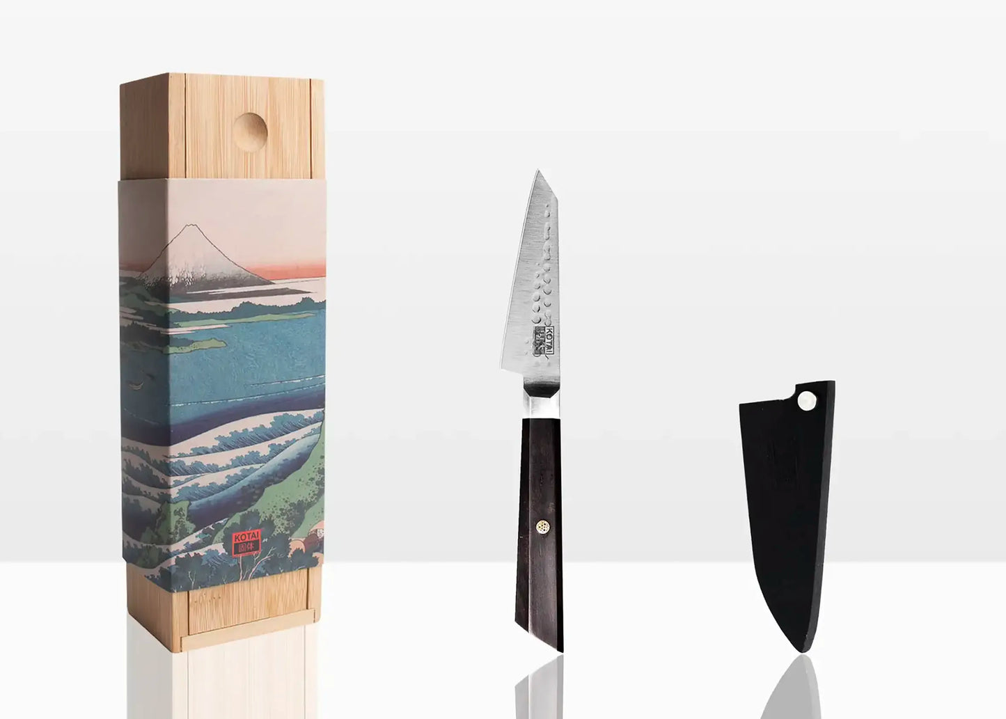 Small 9 cm paring knife with 440C Japanese steel blade and ebony octagonal handle.