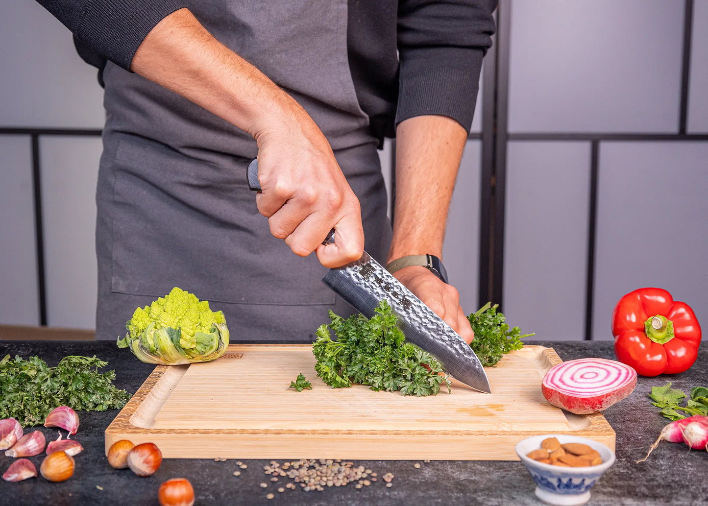 180 mm Santoku knife in 1K6 steel with black pakkawood handle.