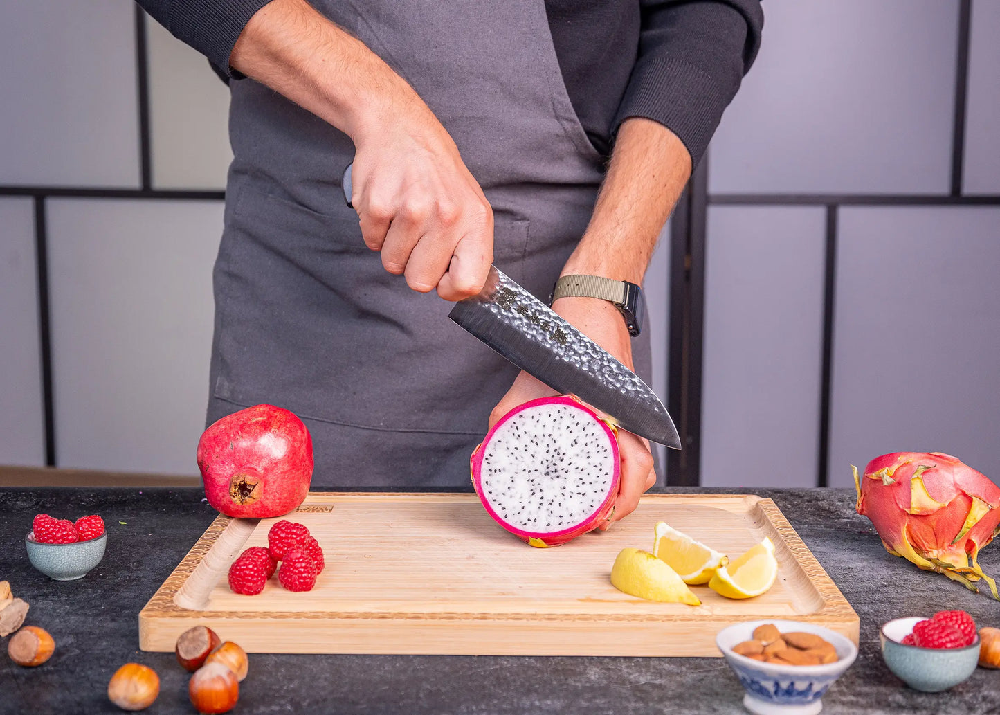 180 mm Santoku knife in 1K6 steel with black pakkawood handle.