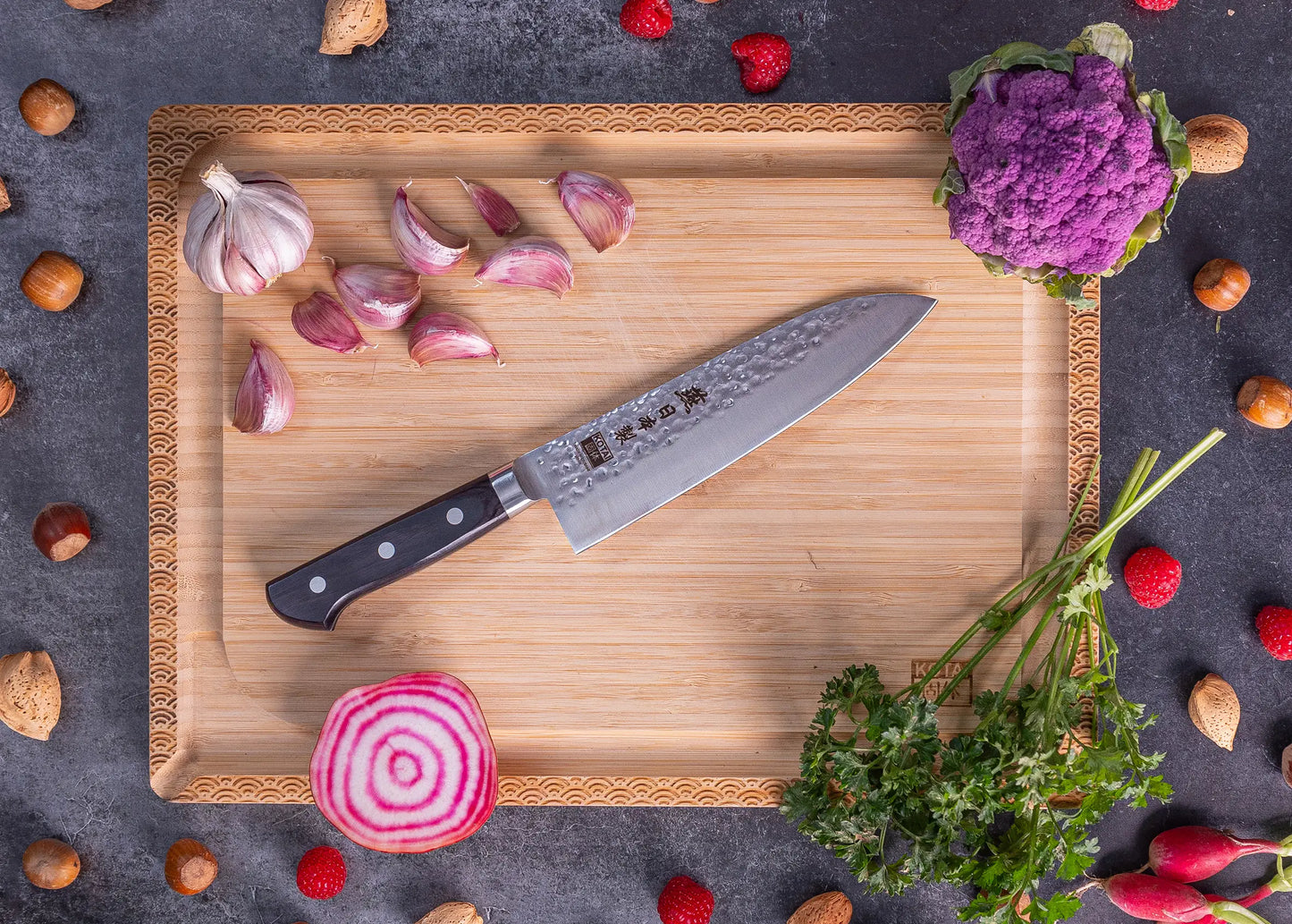 180 mm Santoku knife in 1K6 steel with black pakkawood handle.