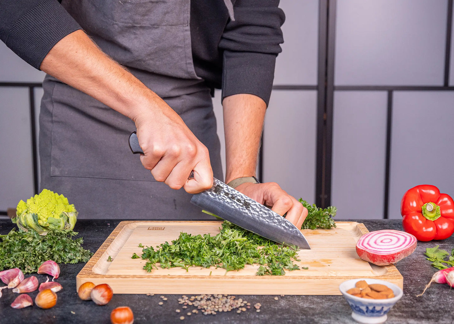 180 mm Santoku knife in 1K6 steel with black pakkawood handle.