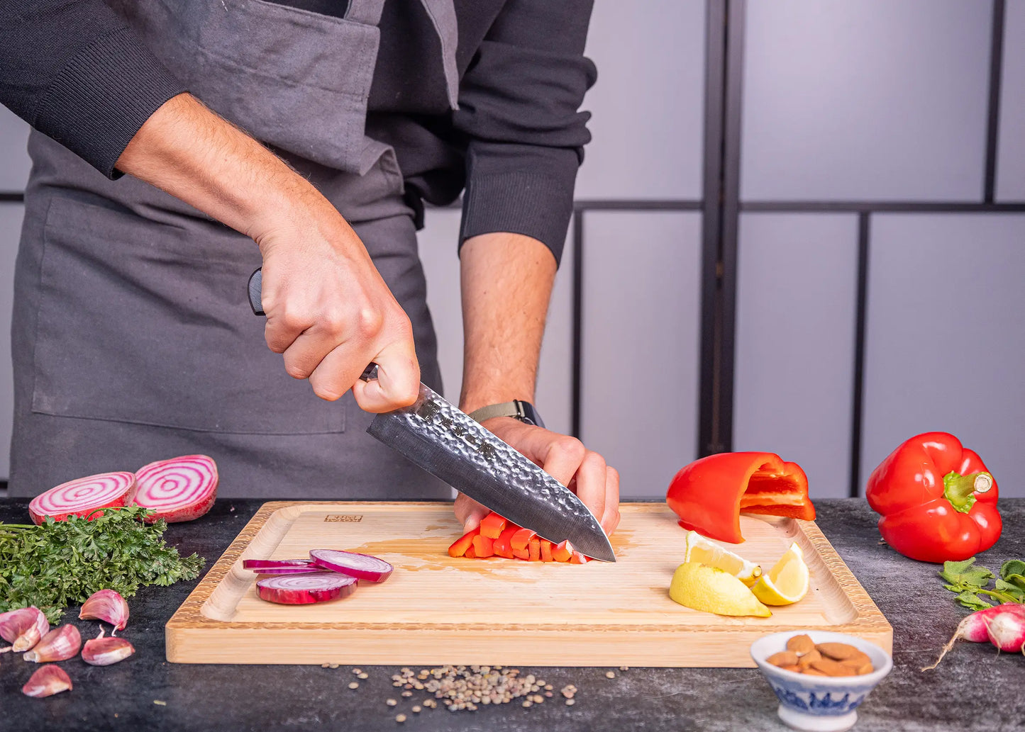 180 mm Santoku knife in 1K6 steel with black pakkawood handle.