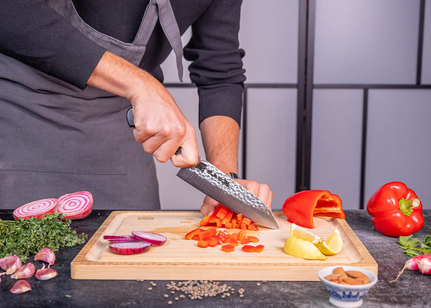 180 mm Santoku knife in 1K6 steel with black pakkawood handle.