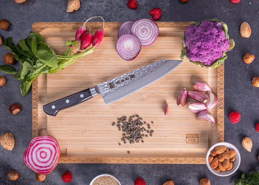 180 mm Santoku knife in 1K6 steel with black pakkawood handle.