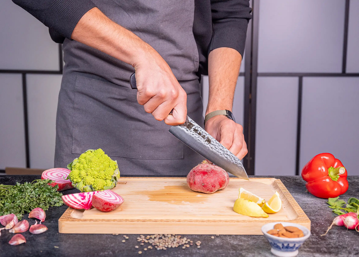 180 mm Santoku knife in 1K6 steel with black pakkawood handle.