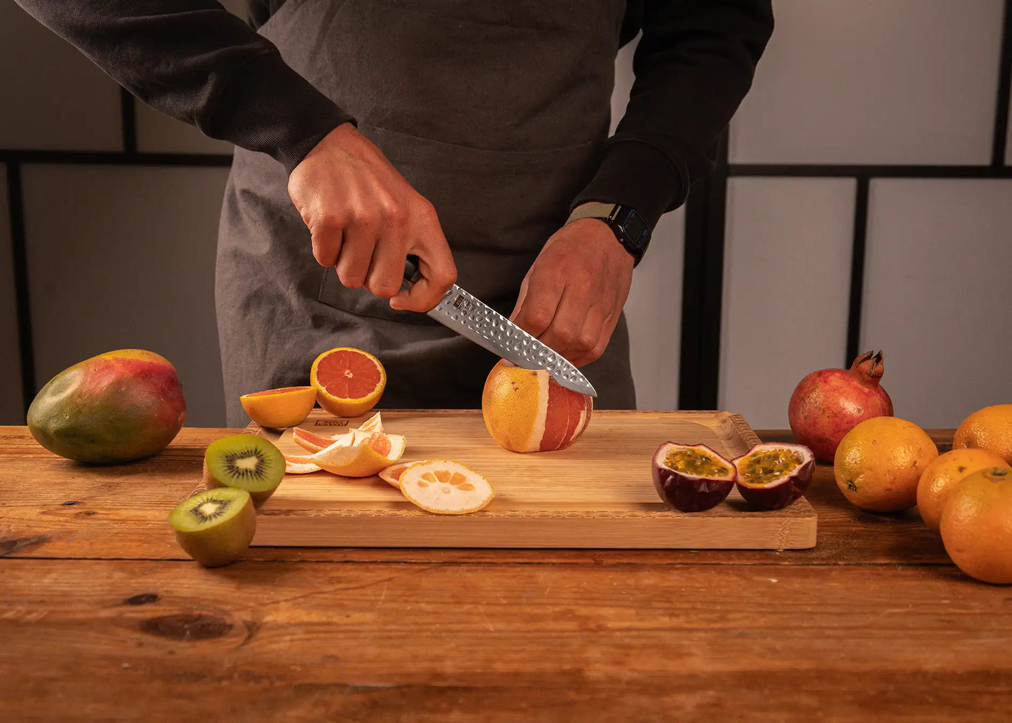 135 mm Hashi Tsuchime Petty knife with hammered stainless steel blade and ABS handle.