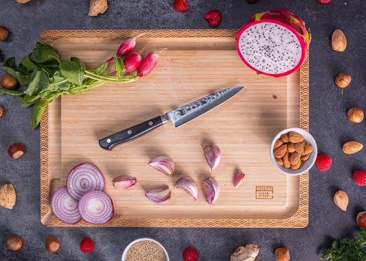 120 mm paring knife in 1K6 steel with black pakkawood handle.