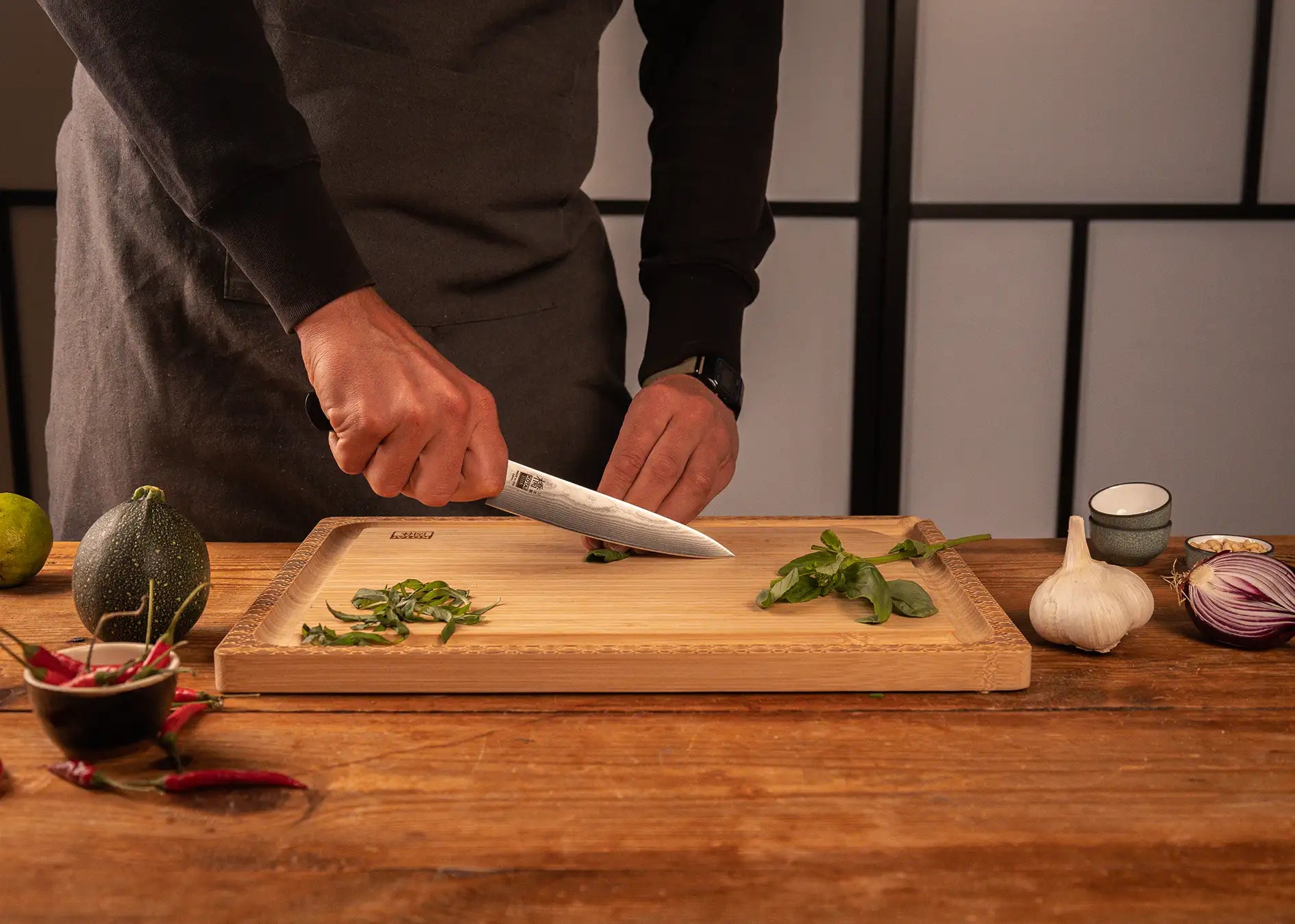 150 mm utility knife with MVS10Cob Damascus blade and pakkawood handle.