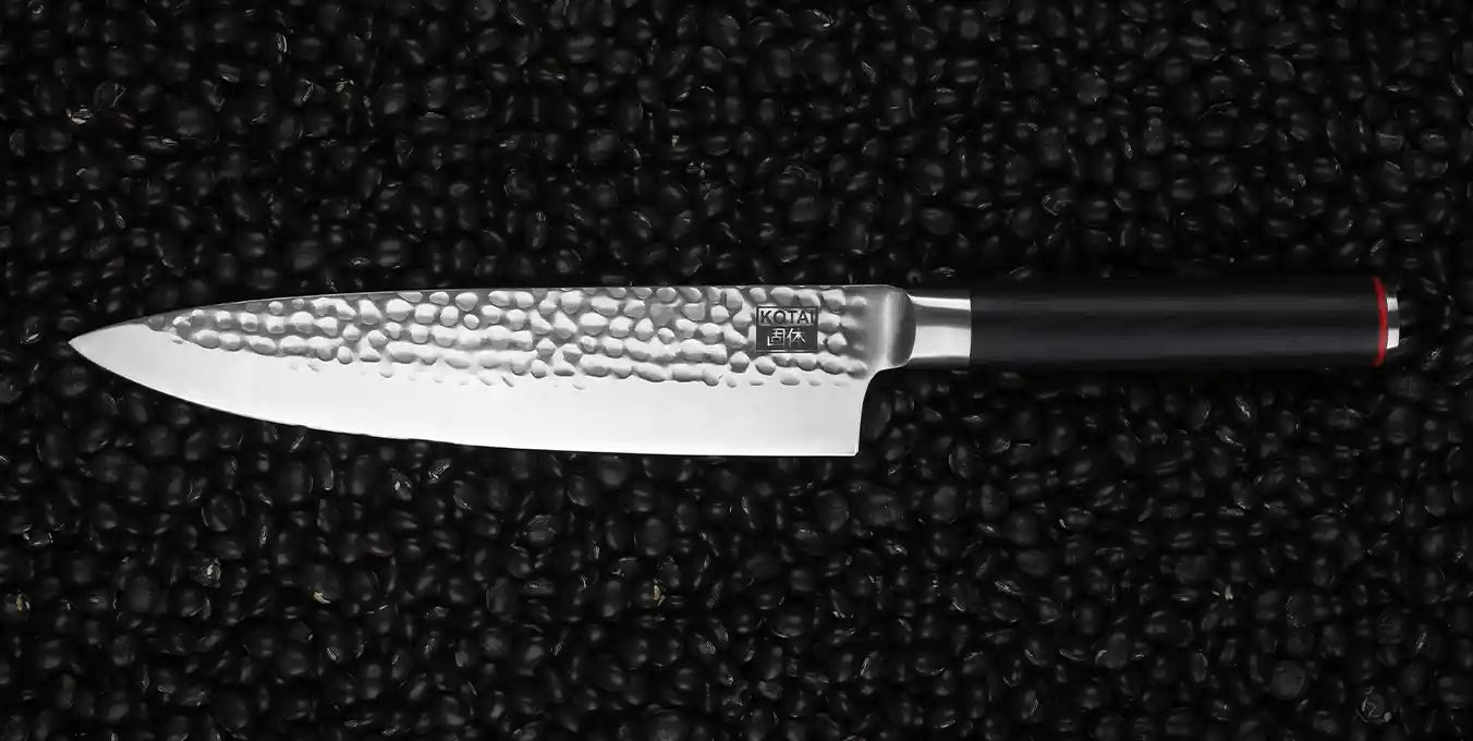 KOTAI's Gyuto also known as Chef's knife displayed on a black background. 
