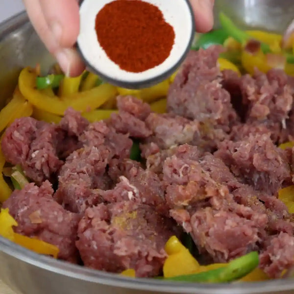 Model has added minced meat to the previous mixture. 