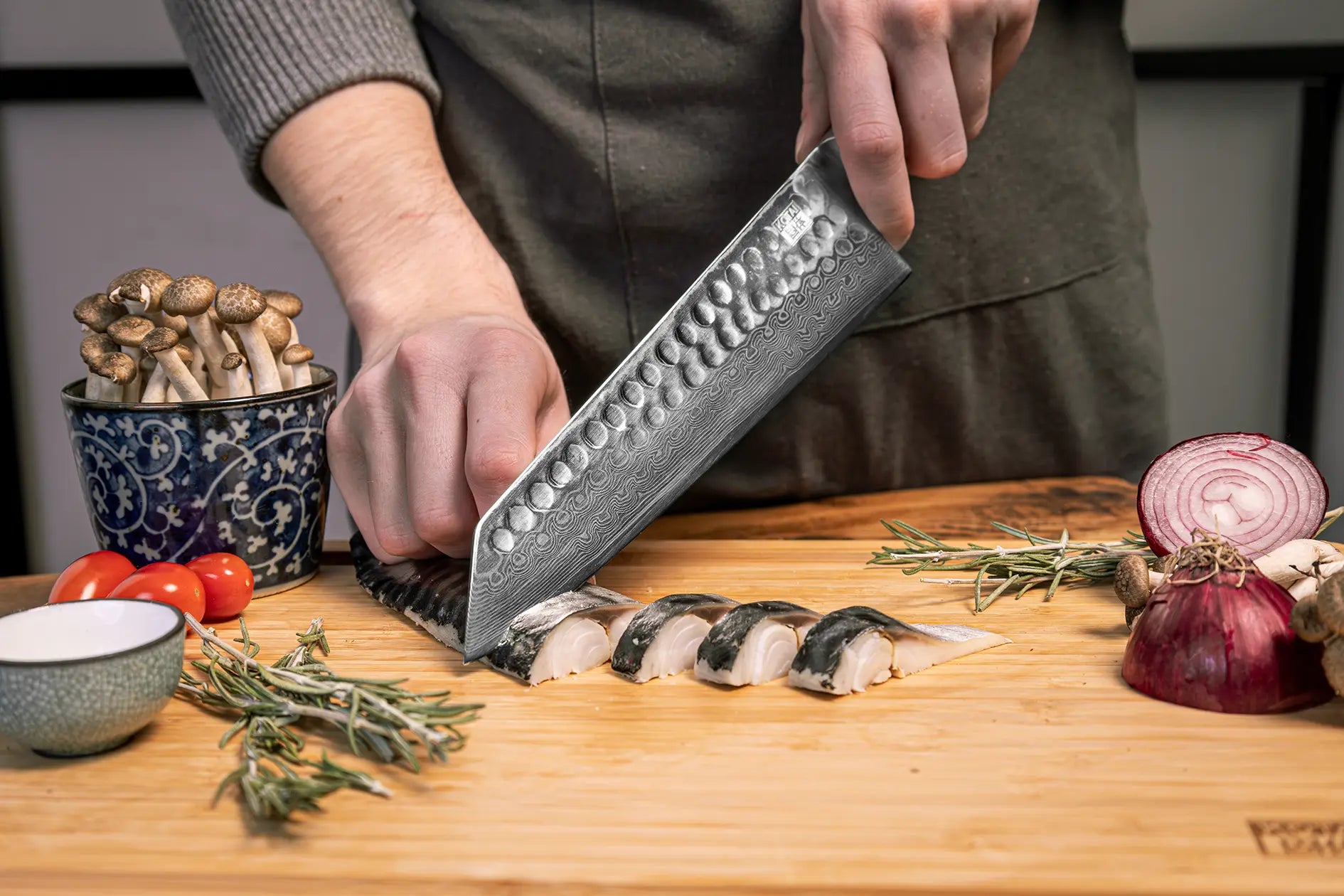 3-Piece Essential Bunka Damascus knife set with patterned AUS-10 steel blades and ebony handles.