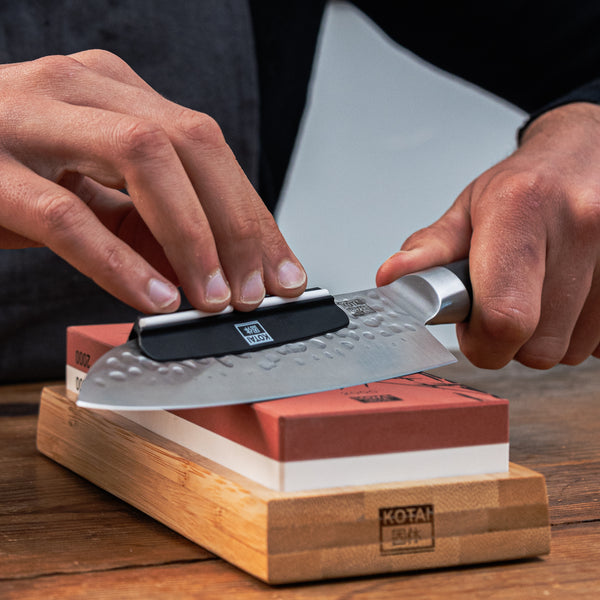 process of sharpening a knife with the kotai's whetstone grit 2000/6000 