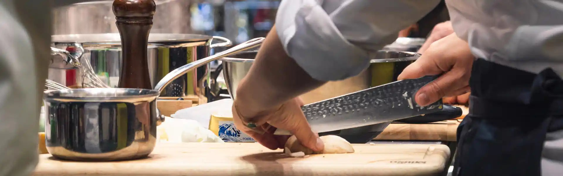 Banner displaying KOTAI knife held by a chef.