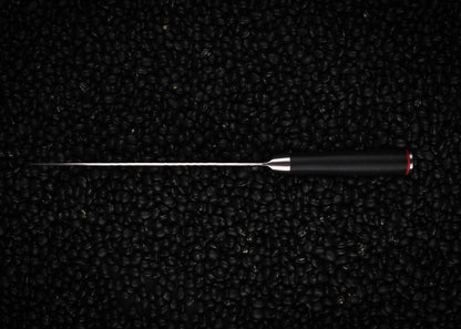 KOTAI Gyuto seen from the top on black beans background.