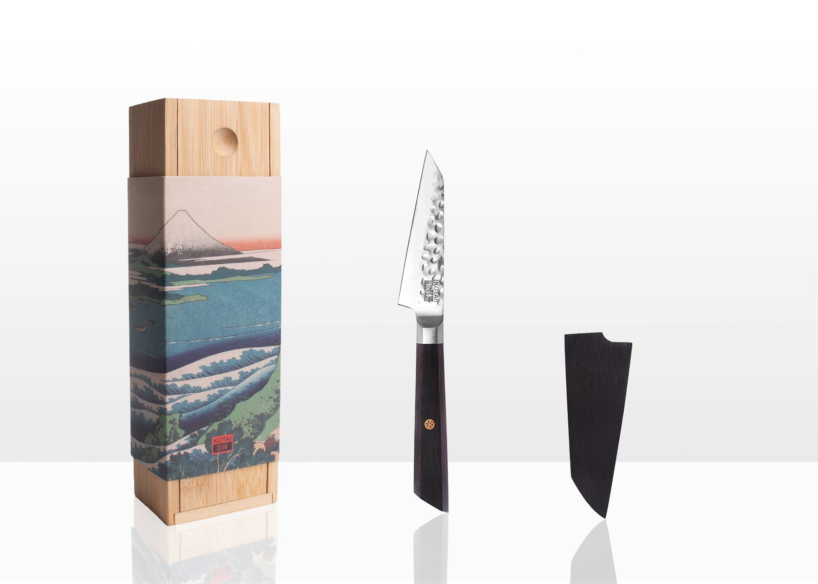 set of two kitchen knives and a bamboo cutting board and their packaging
